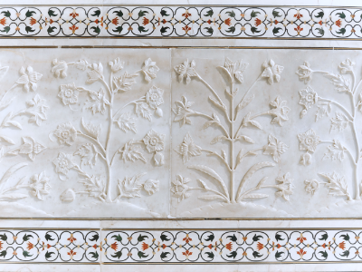 Intricate marble inlay craftsmanship and floral carving on the Taj Mahal exterior