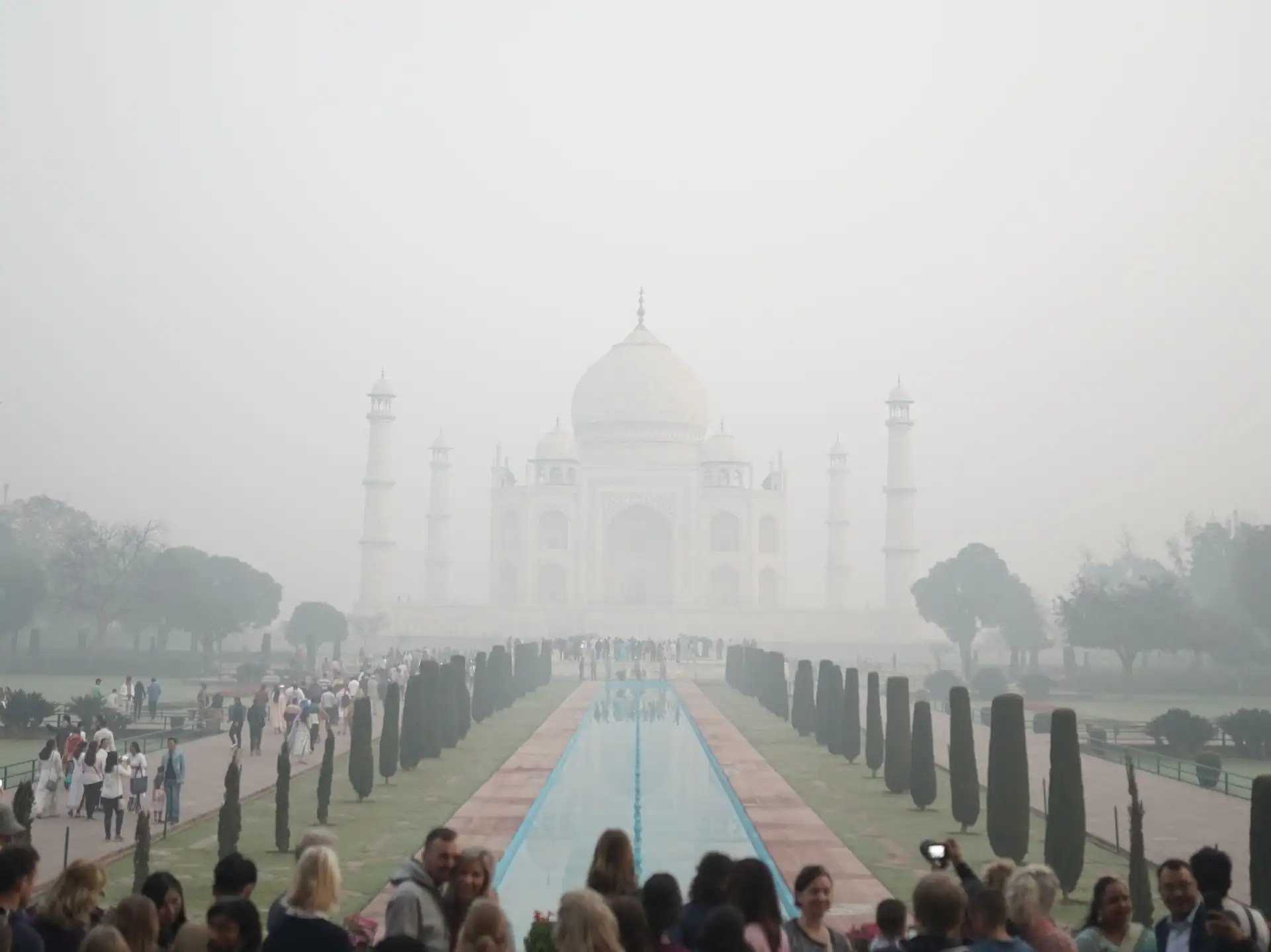 The Taj Mahal surrounded by soft morning light and mist